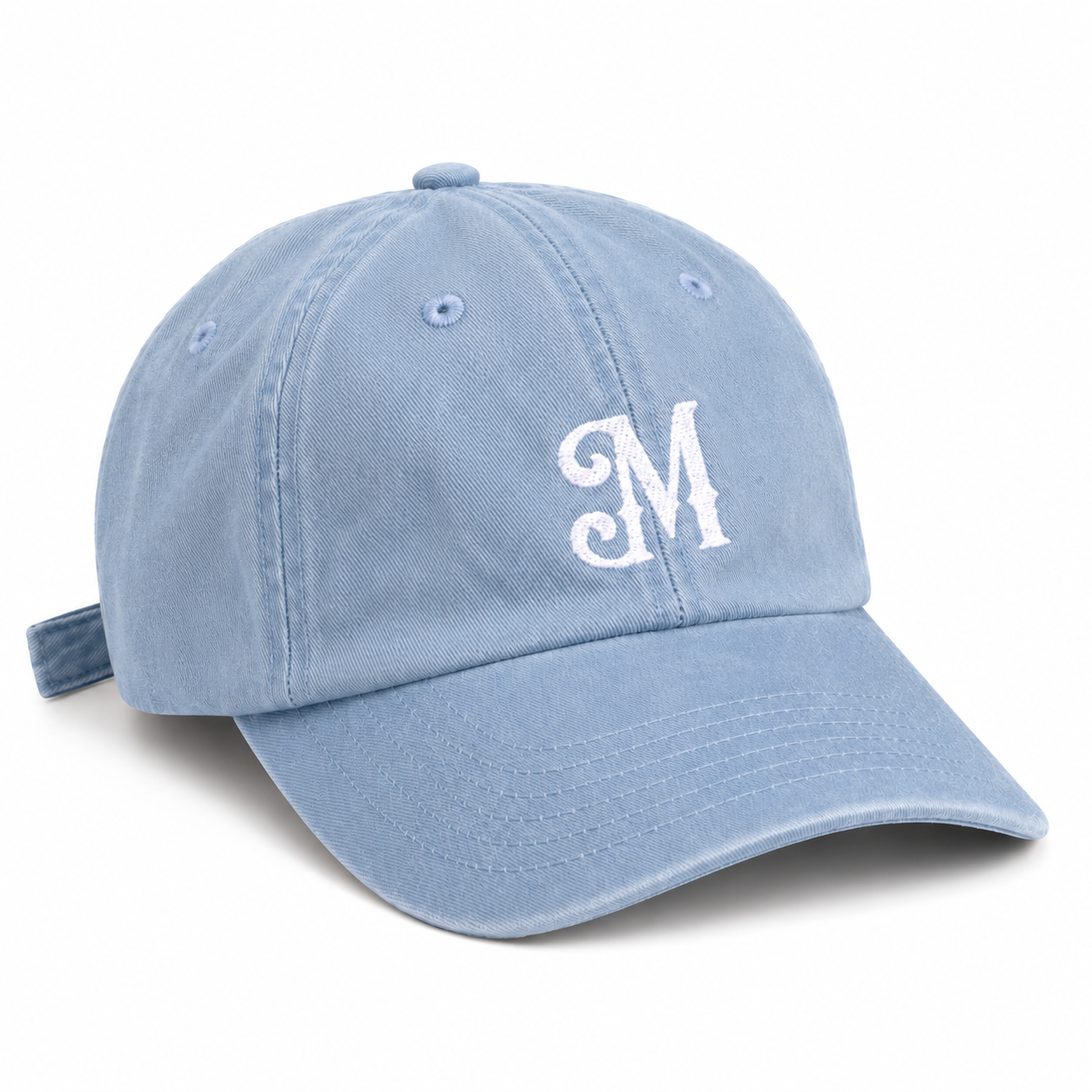 Light blue baseball cap with white embroidered Myrth M monogram on front