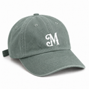 Sage green baseball cap with white embroidered Myrth M monogram on front