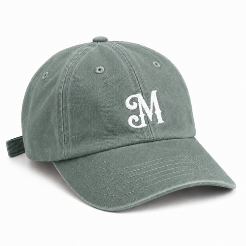 Sage green baseball cap with white embroidered Myrth M monogram on front